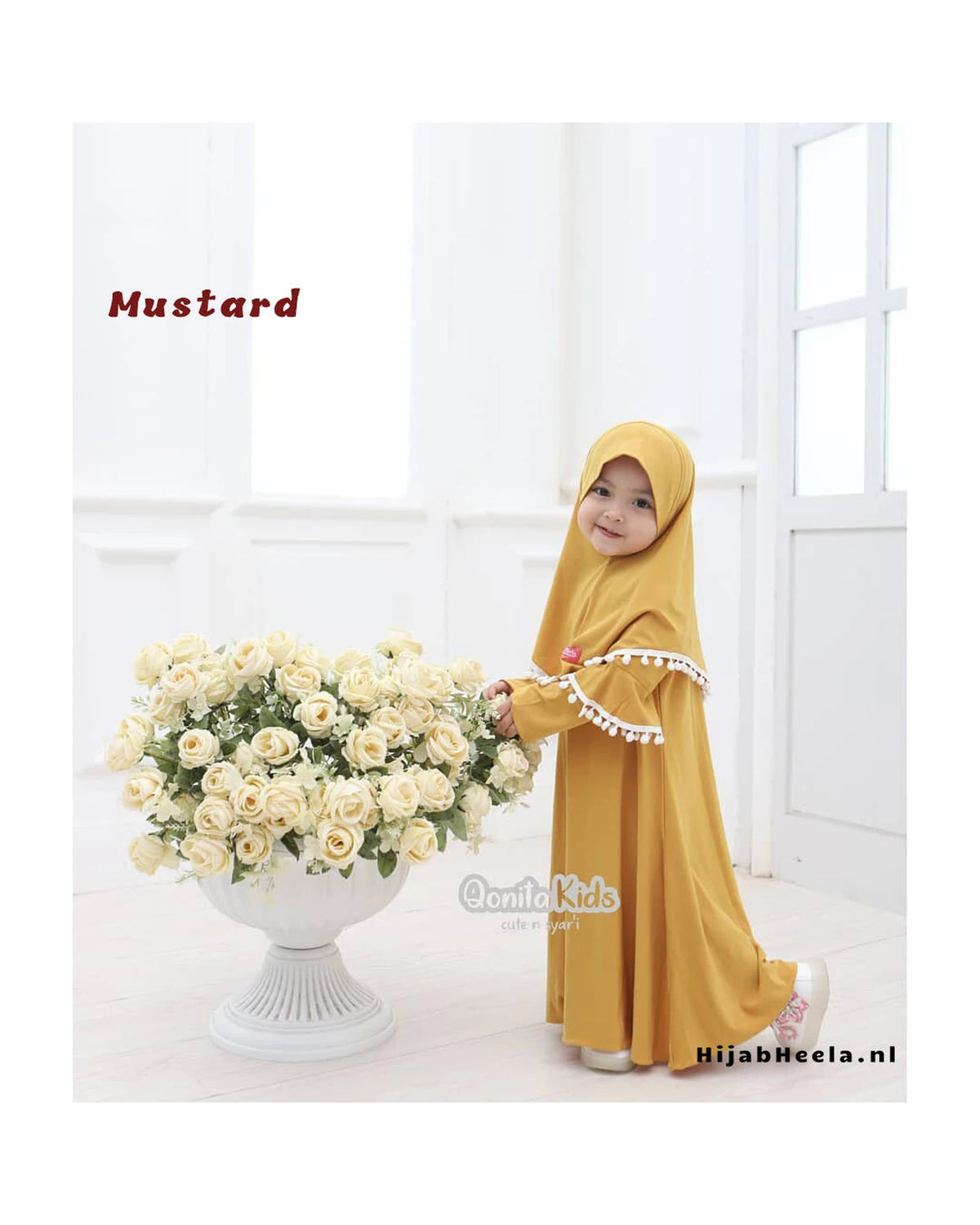 a woman in a yellow dress is holding a bouquet of flowers