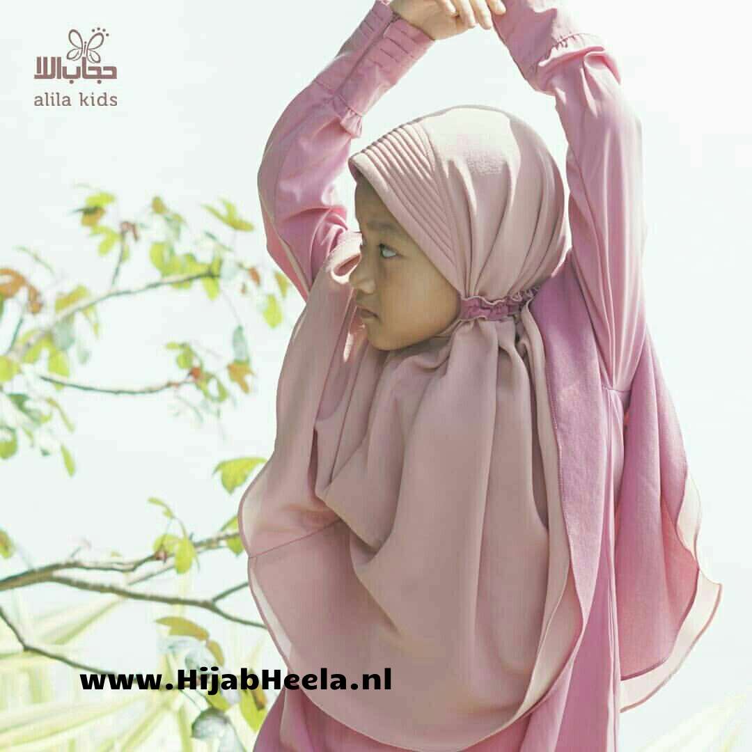 a close up of a person in a pink dress